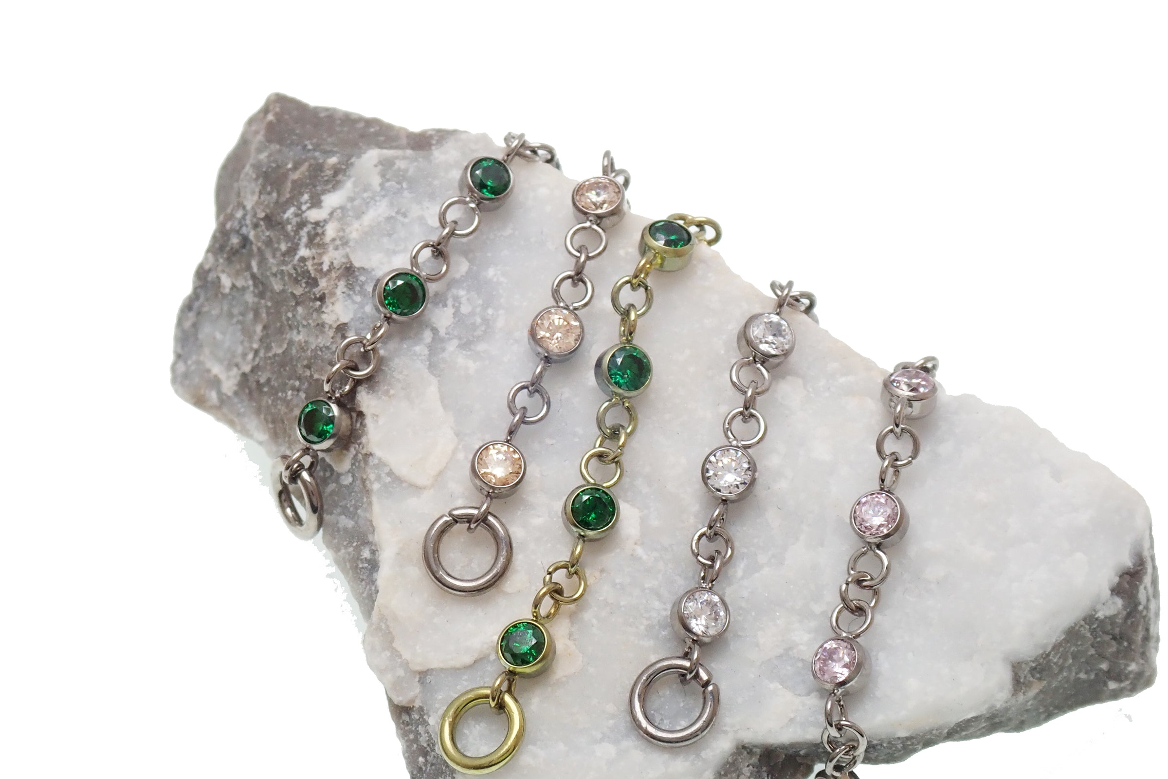 Magpie titanium and CZ ear cuff chain with emerald accents, 32mm or 38mm add-on piercing chain for stylish ear jewelry.