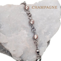 Magpie titanium and CZ add-on ear cuff chain in emerald, 32mm or 38mm length, showcasing a stylish jewelry accessory.