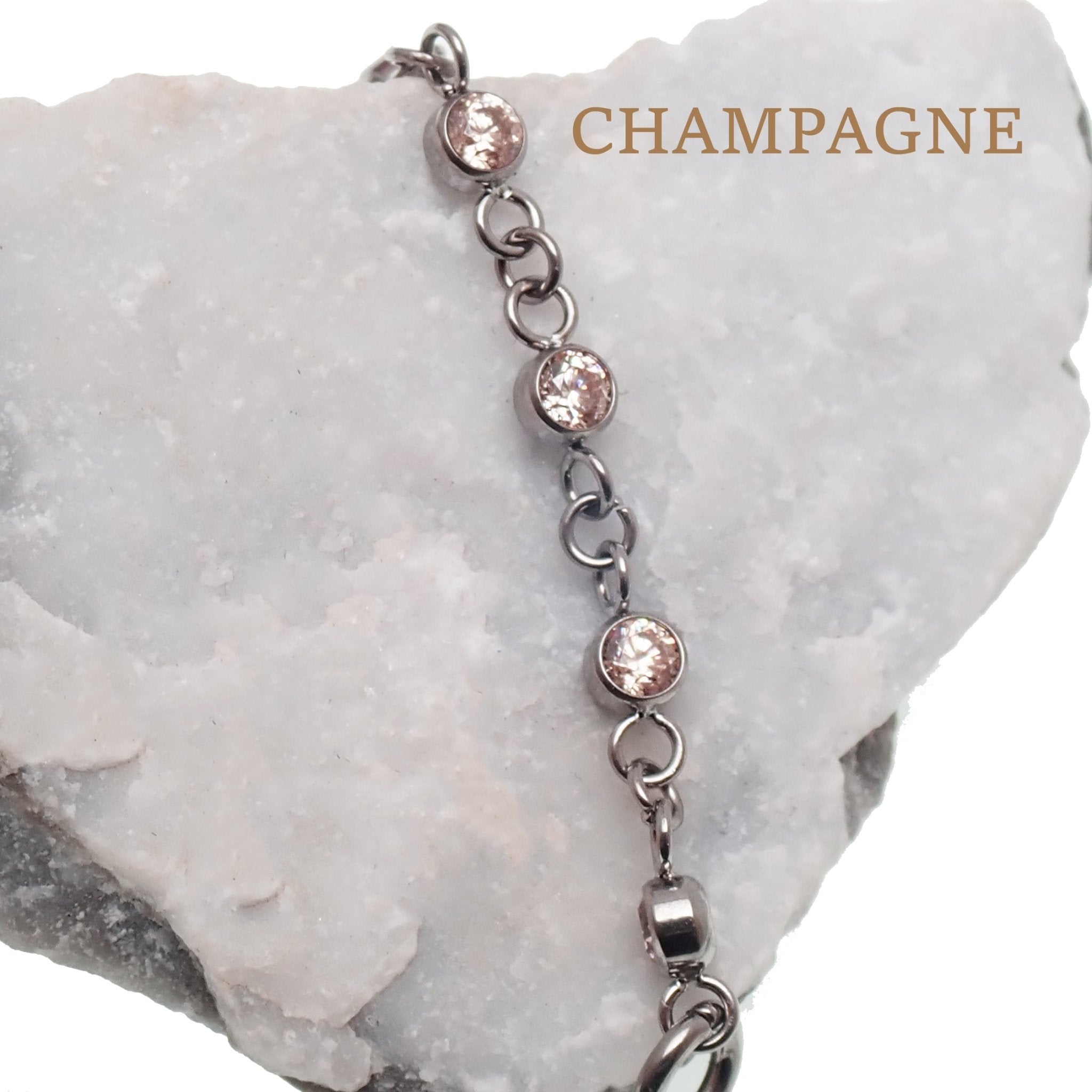 Magpie titanium and CZ add-on ear cuff chain in emerald, 32mm or 38mm length, showcasing a stylish jewelry accessory.