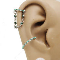 Magpie titanium and cubic zirconia ear cuff chain with emerald accents, available in 32mm or 38mm add-on piercing chain.