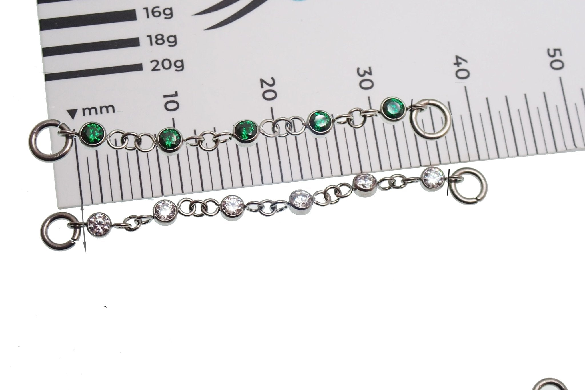 Magpie titanium ear cuff chain with emerald CZ add-on, available in 32mm or 38mm length, stylish jewelry accessory