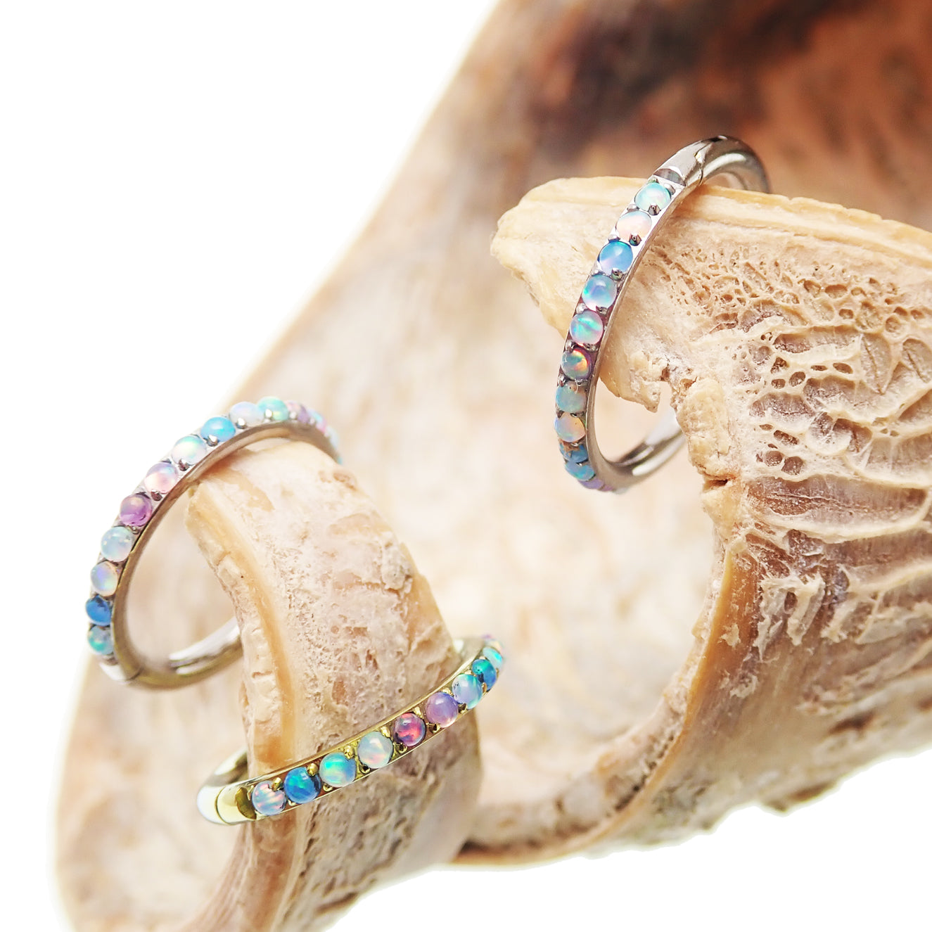 Pastel Opal titanium hinged clicker earring by Magpie, 16g/18g, side-facing view with 6mm diameter for body piercing jewelry.