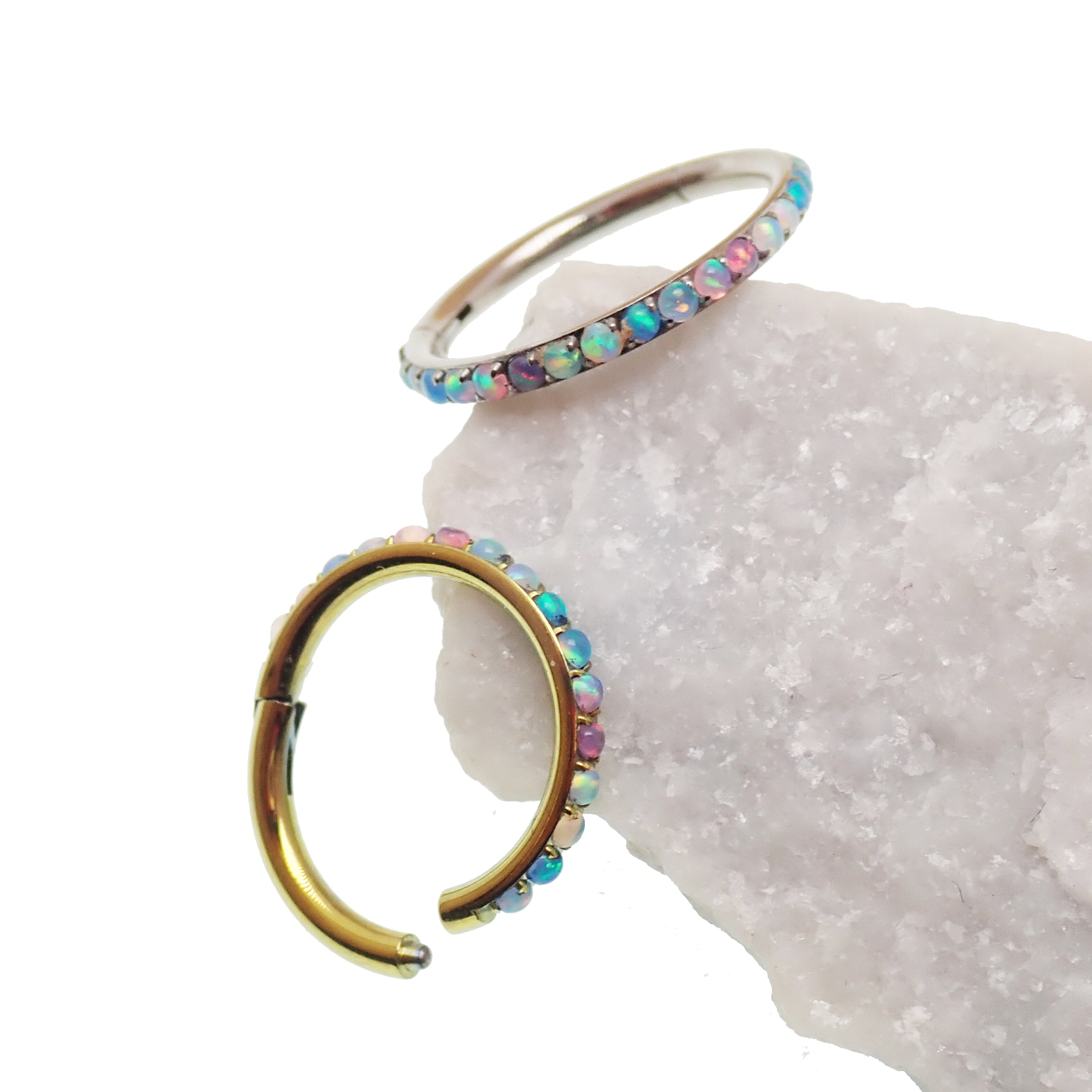 Magpie pastel opal titanium hinged clicker in 16g/18g with side-facing design, featuring a 6mm diameter and secure clasp.