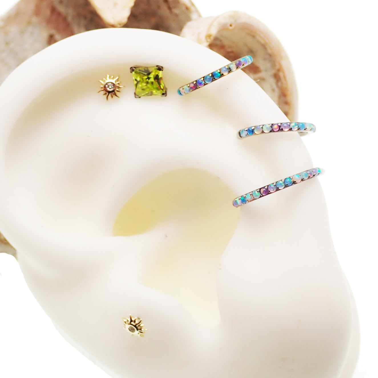 Pastel Opal titanium hinged clicker earrings by Magpie, 16g/18g, side-facing design with 6mm width.