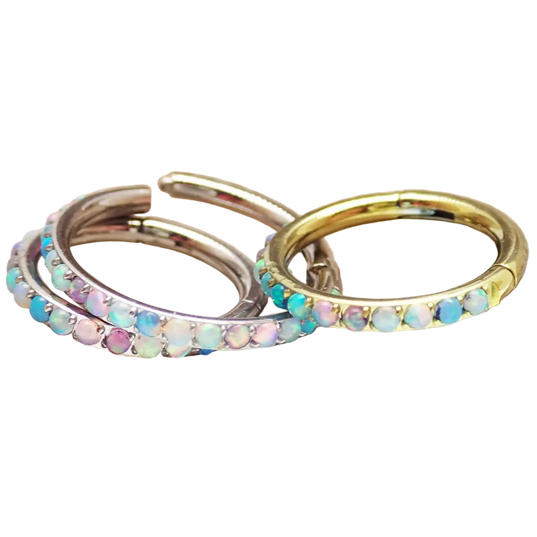 Magpie Pastel Opal titanium hinged clicker in 16g/18g with side-facing design, featuring a 6mm pastel opal accent.