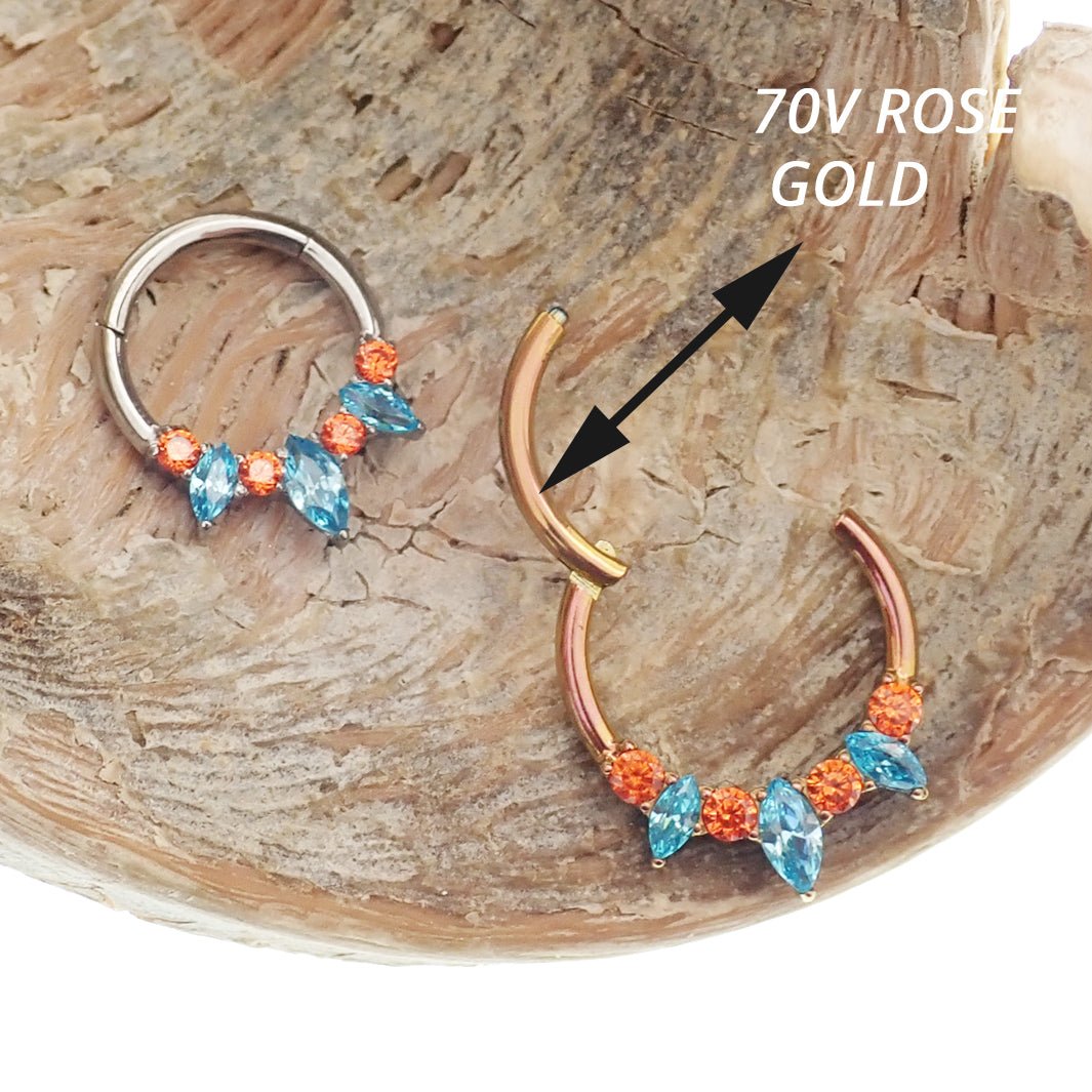 Magpie teal and orange titanium hinged clicker with 8mm diameter, 16g weight, designed for body jewelry piercings.