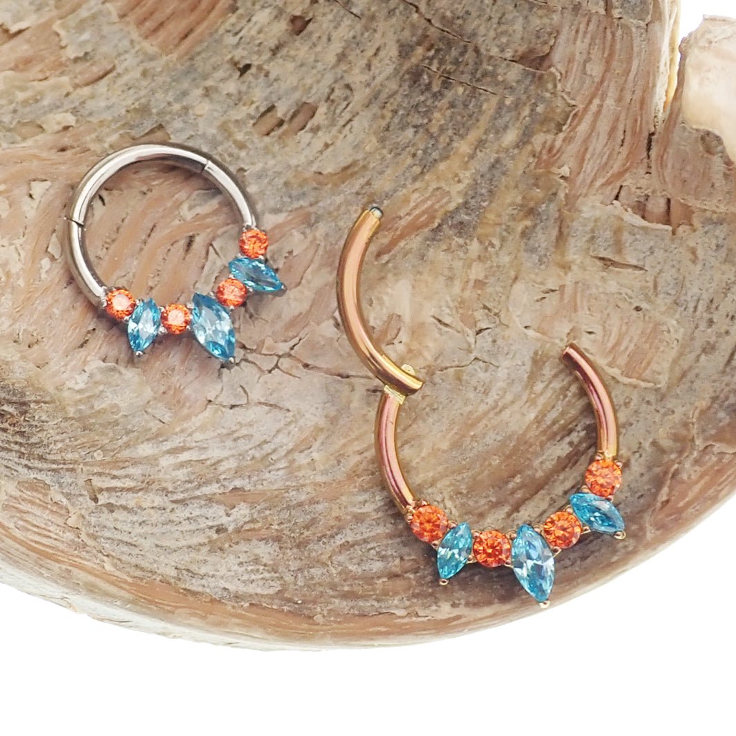Magpie teal and orange titanium hinged clicker 16g with 8mm size, featuring a stylish and durable design for body jewelry.