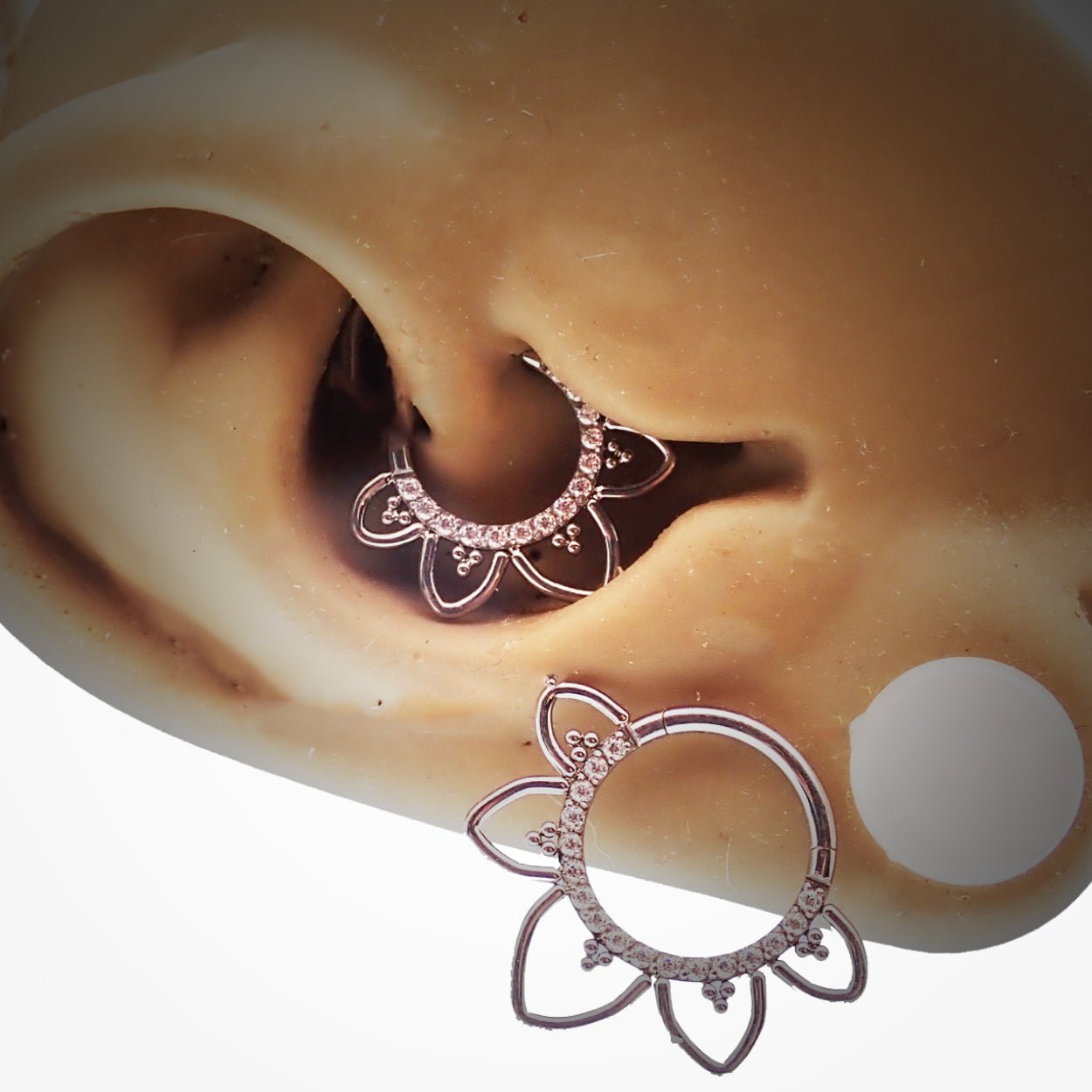 Magpie CZ filigree titanium hinged clicker earring in 16g with intricate design and secure closure.