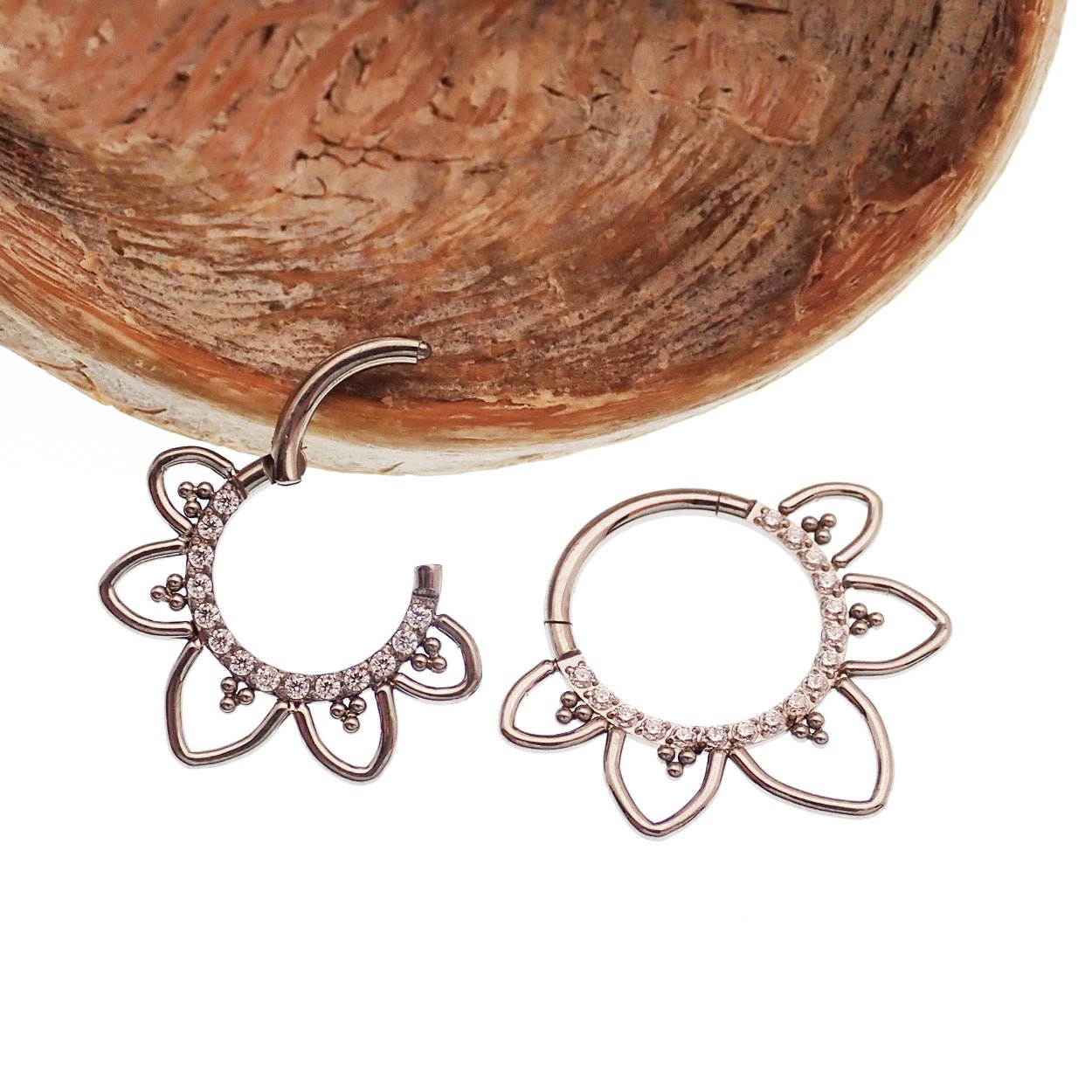 Magpie CZ Filigree Titanium Hinged Clicker in 16g for body piercing, featuring intricate filigree design and secure hinged closure.
