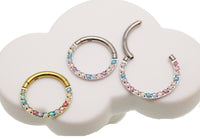 Magpie pastel opal titanium hinged clicker with 8mm and 10mm forward-facing design, 16g body jewelry for body piercing.