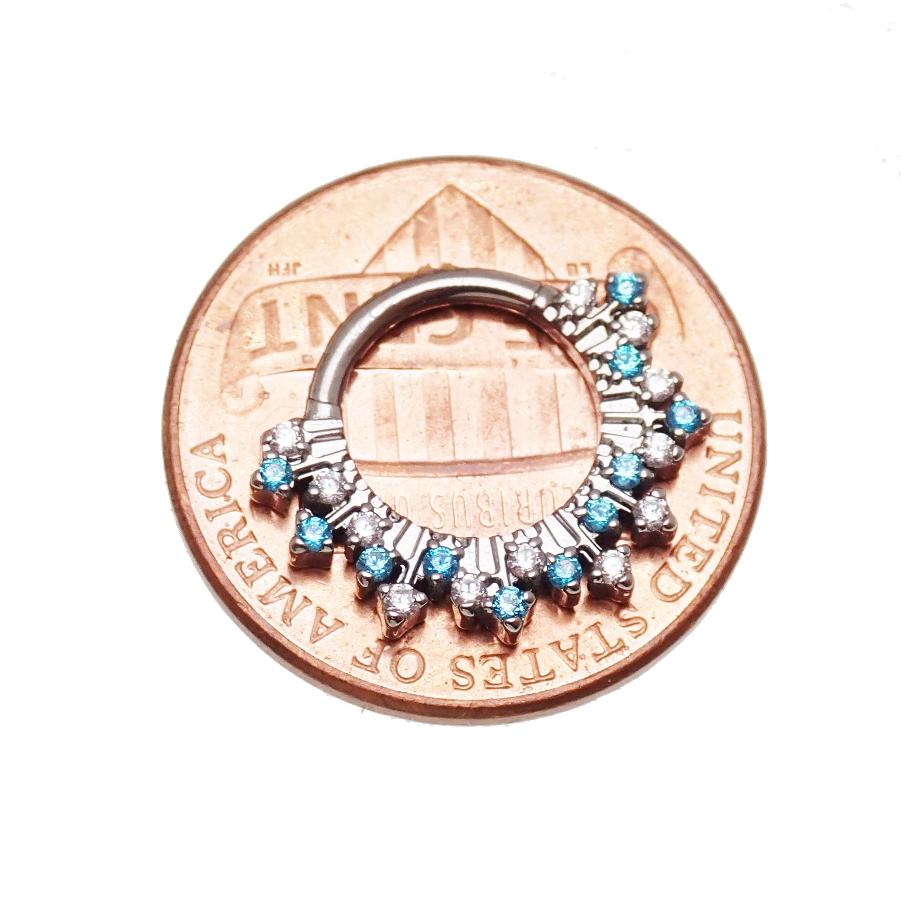 Magpie 16g titanium sunburst CZ hinged clicker with 8mm and 10mm sizes, displayed on a penny, showcasing vibrant design and jewelry detail.