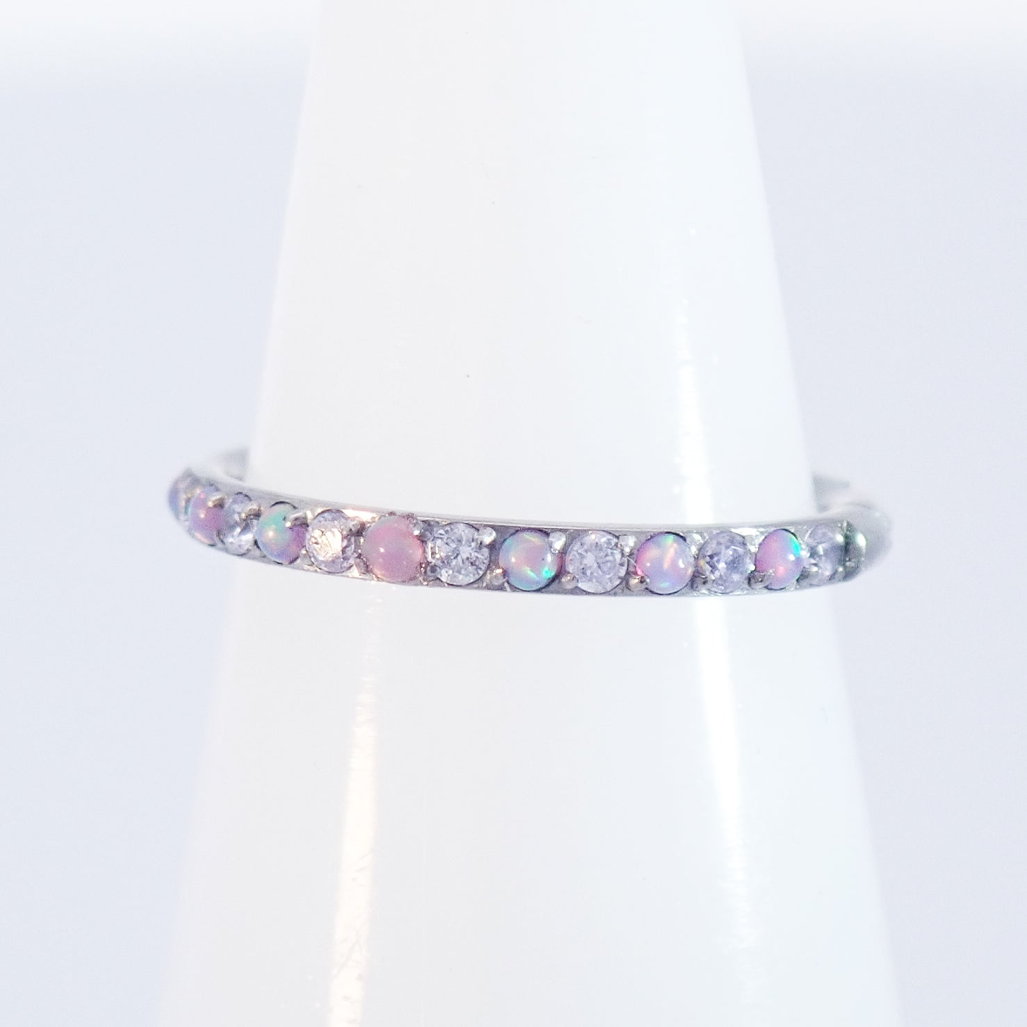 Magpie 16g titanium hinged clicker hoop with lavender opal and CZ stones, available in 8, 10, and 12mm sizes, for body piercing.