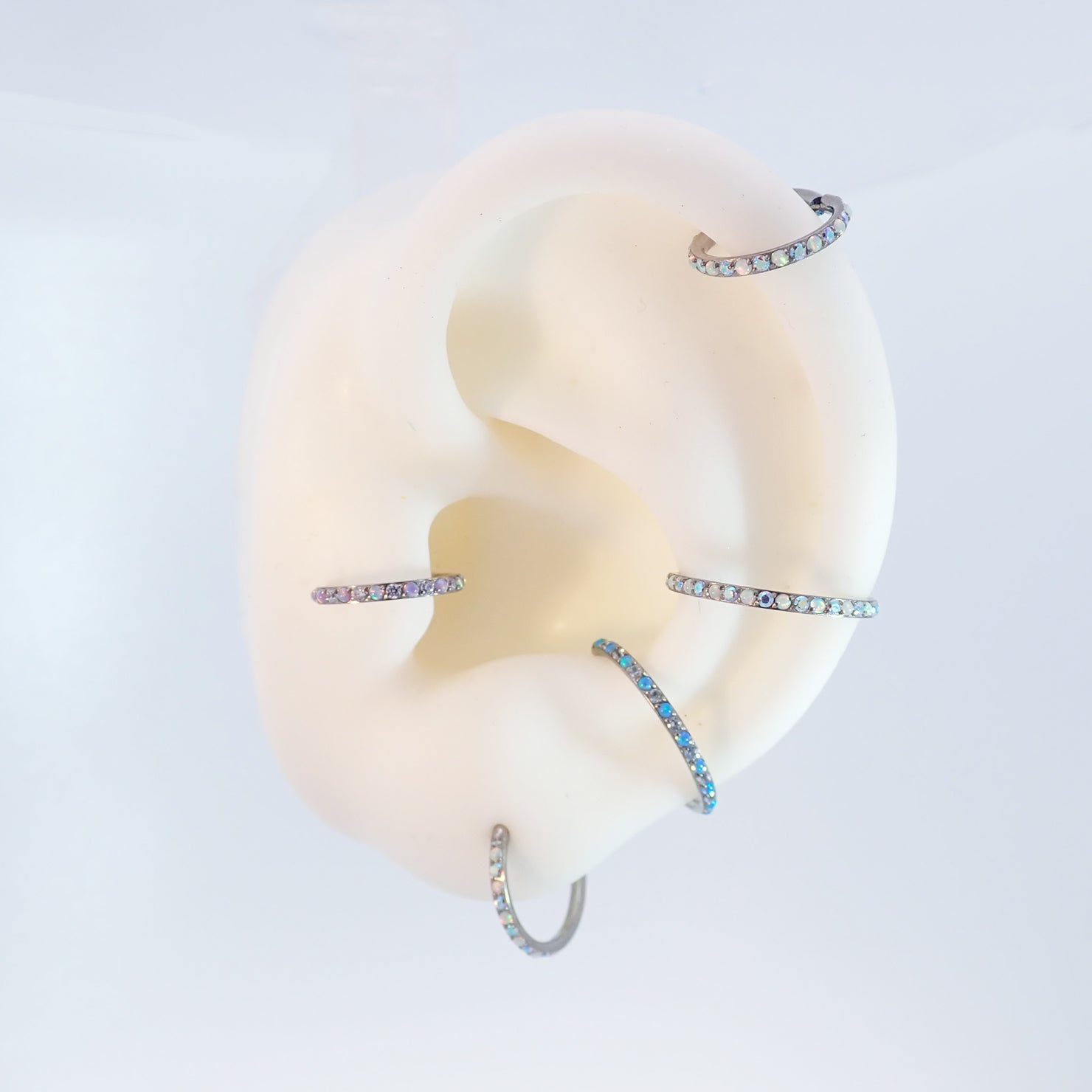 Magpie 16g titanium hinged clicker hoop with opal and cubic zirconia stones, available in 8mm, 10mm, and 12mm sizes.