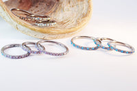 Titanium hinged clicker hoop with opal and cubic zirconia accents, available in 8mm, 10mm, and 12mm sizes.