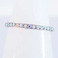 Magpie 16g titanium hinged opal and CZ rainbow clicker hoop in white with colorful stones, available in 8, 10, and 12mm sizes.