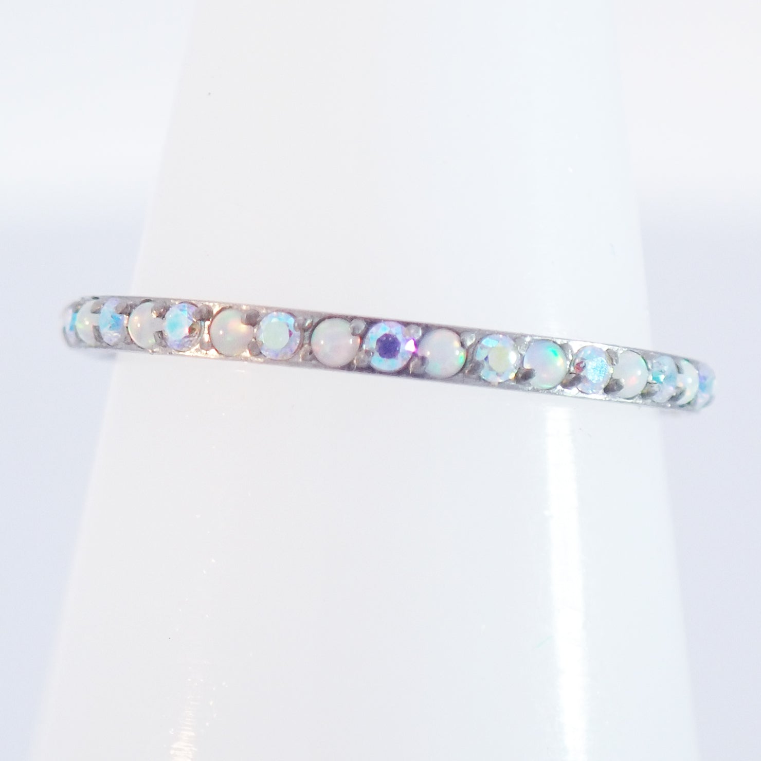 Magpie 16g titanium hinged opal and CZ rainbow clicker hoop in white with colorful stones, available in 8, 10, and 12mm sizes.