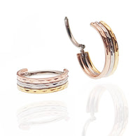 Hammered Trio metal septum clicker by Magpie, 8mm stacked design, 16g, with textured hammered finish and layered metal style.