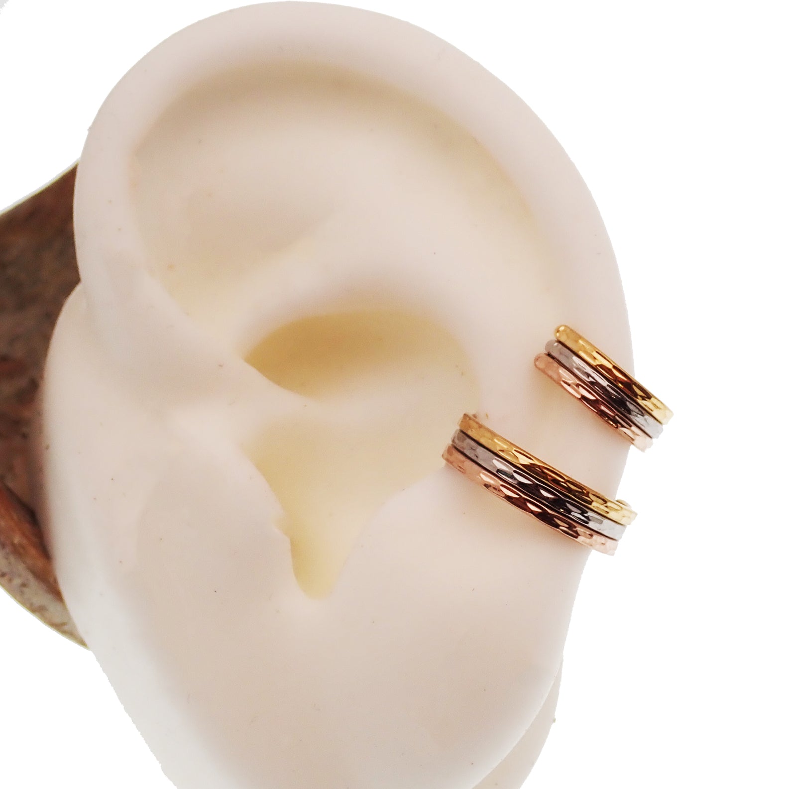 Hammered Trio metal septum clicker by Magpie, 16g, 8mm, stacked design with textured hammered finish.
