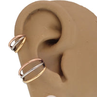 Magpie triple metal stacked titanium septum clicker 16g with 8mm diameter, showcasing layered metal design and secure clasp.