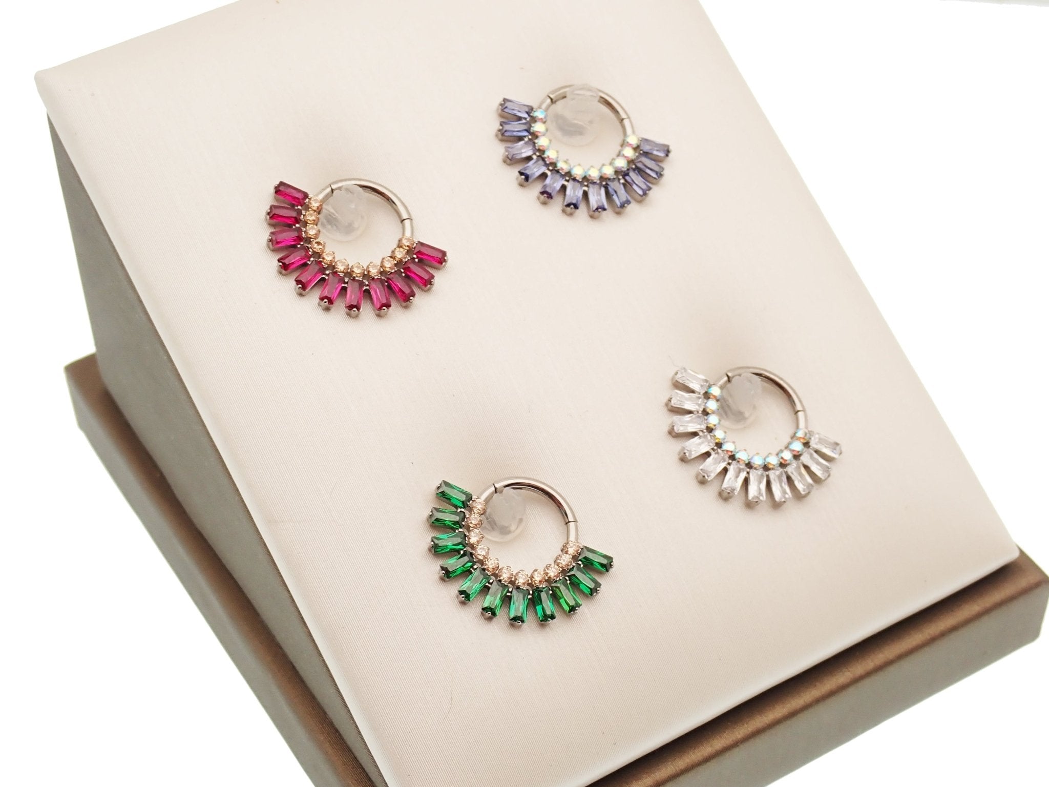 Magpie Super Nova CZ titanium septum clicker in cerise champagne finish, 16g gauge, 8mm diameter.