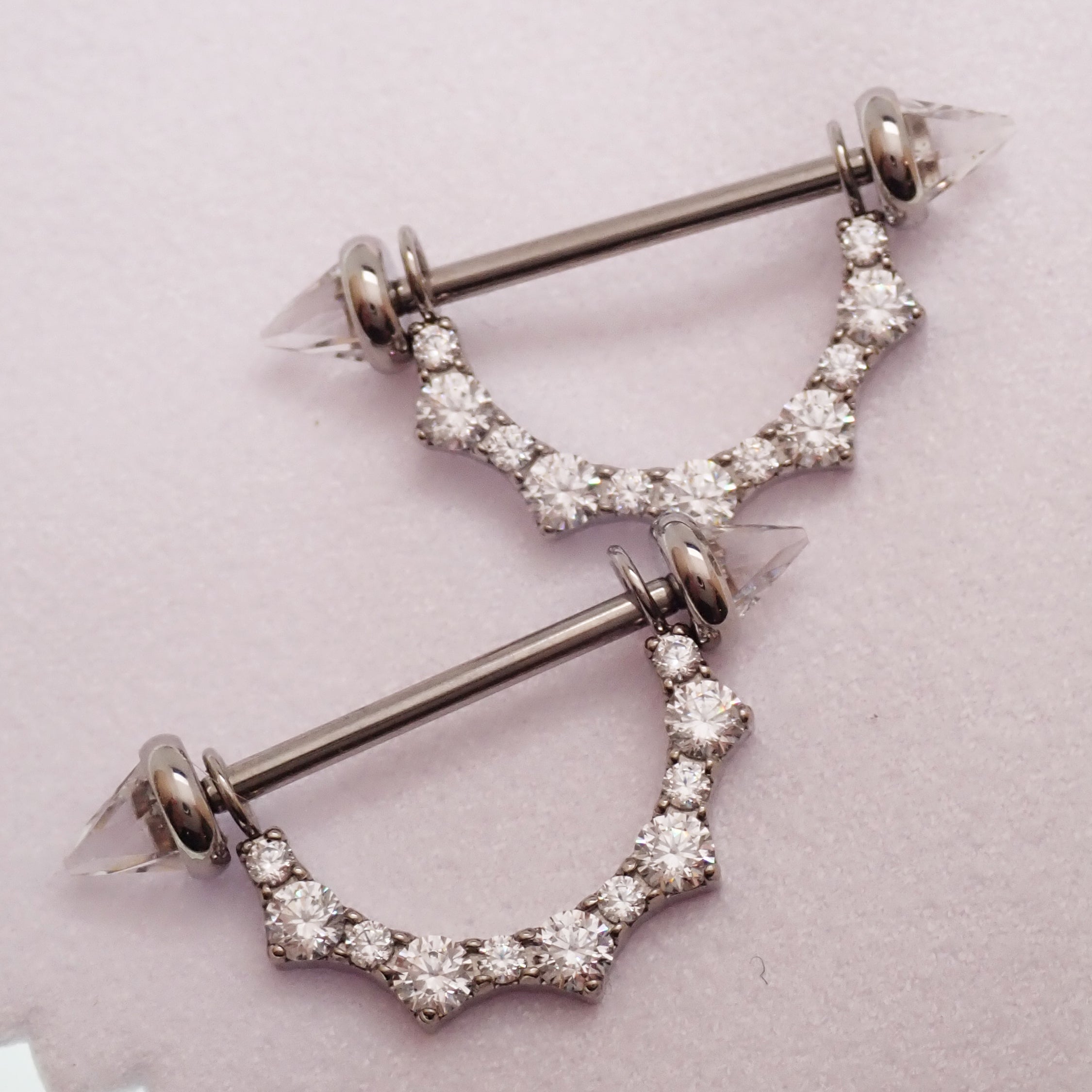 Titanium CZ shield nipple ring barbell with internal threading, 14mm or 16mm, Body Clickers body jewelry, shown with white backing.