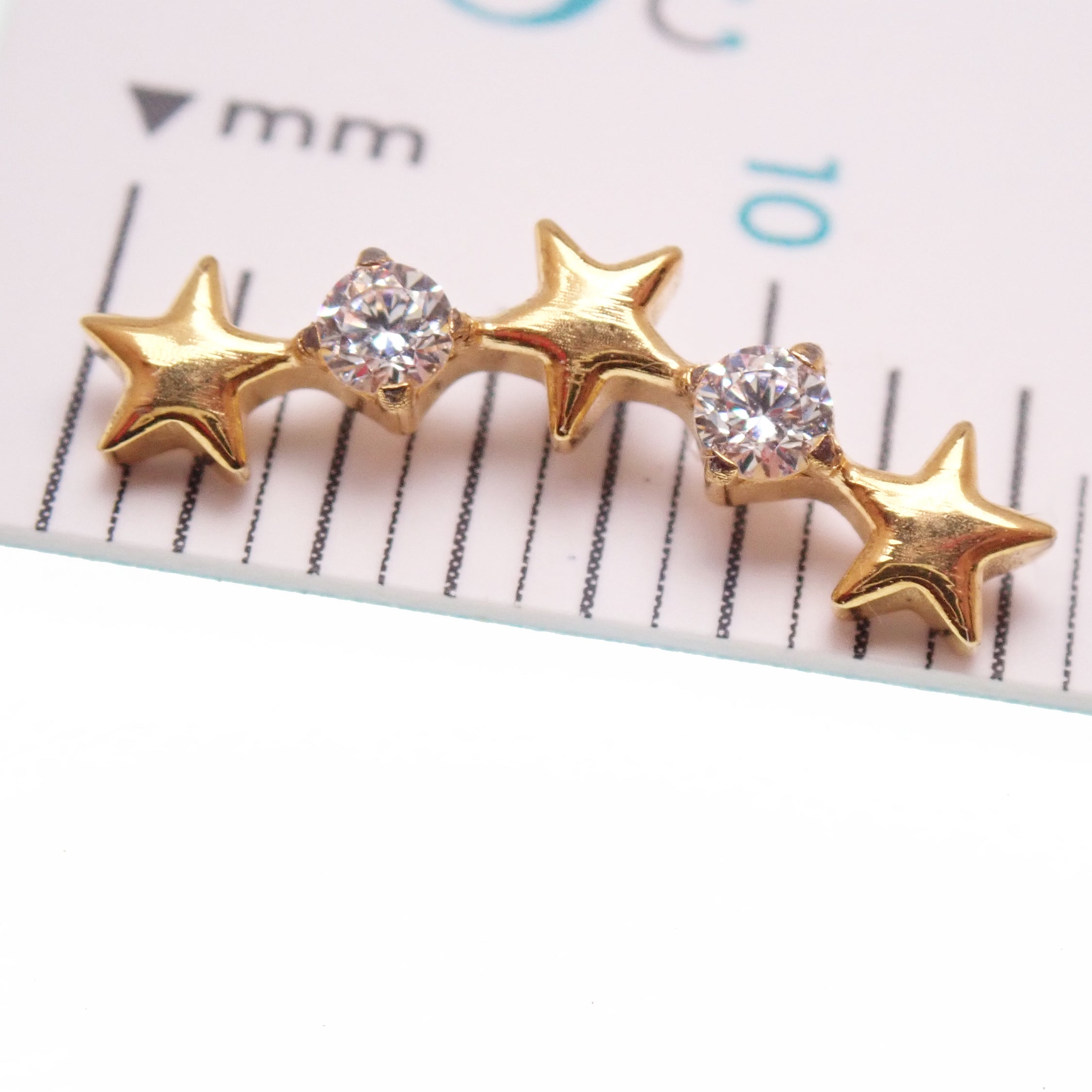 Star CZ PVD gold helix curve titanium flatback labret piercing earrings with measurement card display, available in 14g, 16g, 18g.