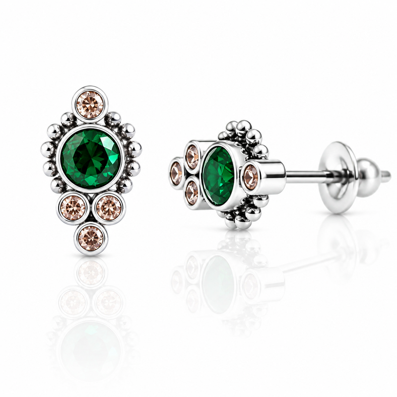 Titanium earrings with emerald and champagne-colored accents, 20g implant style, featuring sleek, modern jewelry design.