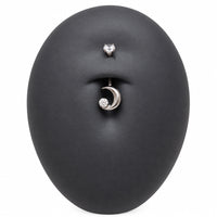 Moon CZ belly bar in a silicone belly button model