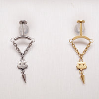 vertical helixpiercing jewelry with chains draping to a cat silhouette with a cone charm under, all on a textured white background