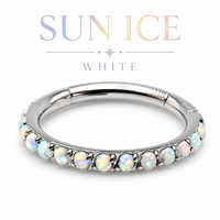 Silver ring with opal stones on a white background, featuring the brand 'Sun Ice'.
