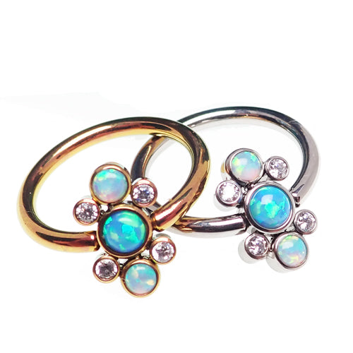 Titanium cluster blue opal closure ring by Body Clickers, 16g, 1-2mm thick, 10mm diameter, with vibrant blue opal stones.