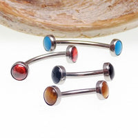 Titanium natural stone curves with tiger's eye and 1.2mm gauge for body jewelry, featuring smooth curved design and multi-colored stones.