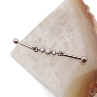 Industrial CZ piercing by Body Clickers with moveable titanium push pin, available in 14g and 16g sizes.
