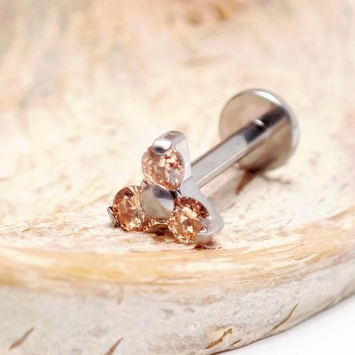 Champagne-colored Body Clickers flat back rhinestone cluster in an 18g, 6mm size, designed for body jewelry and body art.
