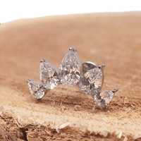 Clear cubic zirconia peardrop crown titanium flatback piercing in 14g, 16g, and 18g with a sleek, elegant design.