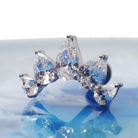 Clear CZ peardrop crown titanium flatback piercing in 14g, 16g, and 18g sizes, with shiny gemstone and smooth metal finish.