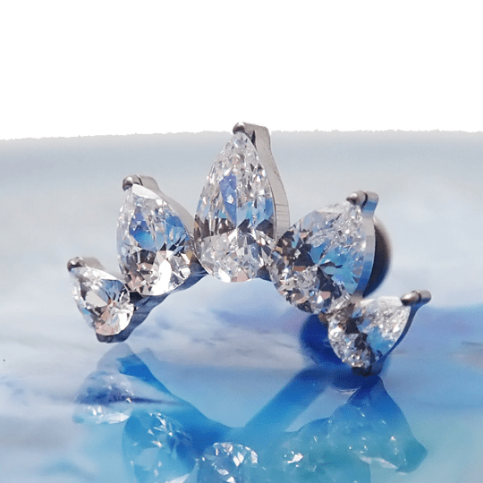 Clear CZ peardrop crown titanium flatback piercing in 14g, 16g, and 18g sizes, with shiny gemstone and smooth metal finish.
