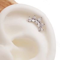 Clear cubic zirconia peardrop crown titanium flatback piercing in 14g, 16g, and 18g, featuring a shiny peardrop design.