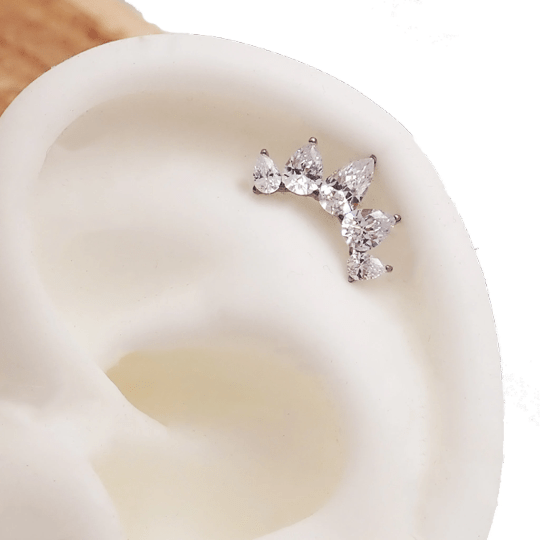 Clear cubic zirconia peardrop crown titanium flatback piercing in 14g, 16g, and 18g, featuring a shiny peardrop design.