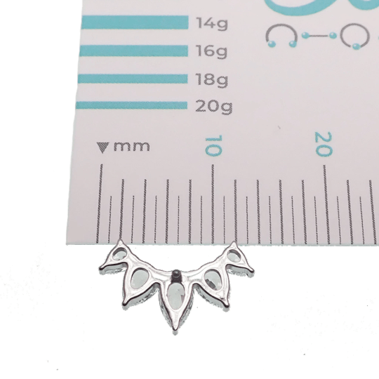 Clear cubic zirconia peardrop crown titanium flatback piercing in 14g, 16g, and 18g, shown in a close-up view.