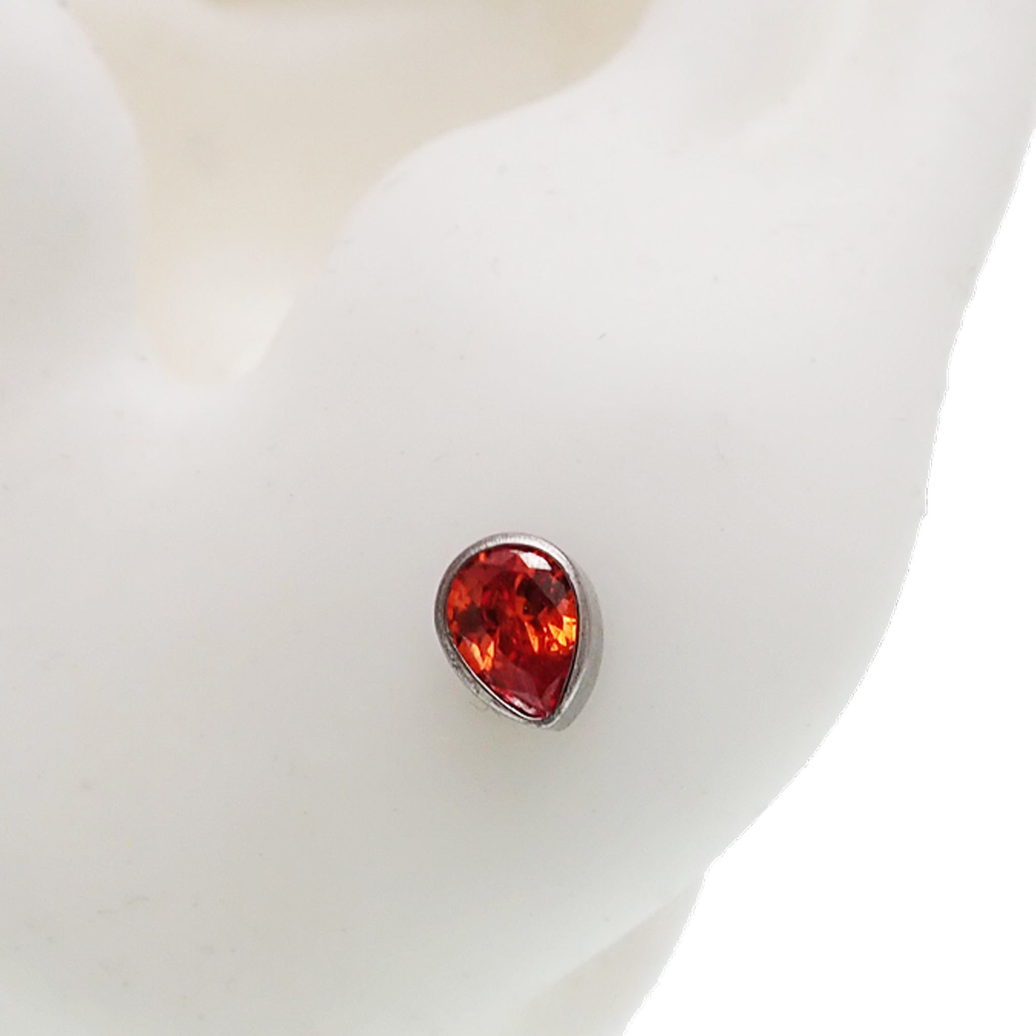 Orange teardrop titanium push fit flatback body piercing jewelry in 14g to 20g from Body Clickers.