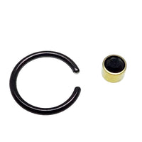 Titanium black and gold CBR onyx ring, 14g, with black and gold design, featuring a sleek, polished appearance.