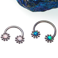 Peacock blue Opal Sun circular body rings by Body Clickers, 16g gauge, featuring a vibrant, circular design for body piercing.