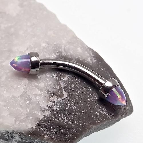 Black fire spiked opal cone jewelry with curved 16g barbell for body piercing, featuring a striking spiked design and vibrant opal accents.