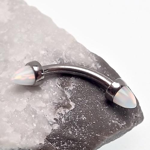 Black spiked opal cone with curved barbell 16g from Body Clickers, jewelry accessory for body piercing.