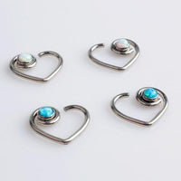 Peacock blue opal heart-shaped BCR piercing by Body Clickers, 16g, with a shiny, smooth heart-shaped design for ear or body piercing.