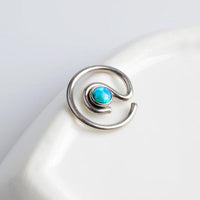Peacock blue spiral opal titanium captive bead ring from Body Clickers, 16g BCR for body piercing.
