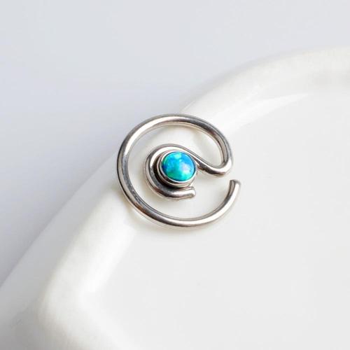Peacock blue spiral opal titanium captive bead ring from Body Clickers, 16g BCR for body piercing.