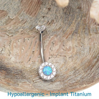 Clear CZ and Azure Blue Opal titanium belly ring, 10mm, 14g, body jewelry by Body Clickers featuring a sleek belly bar design.