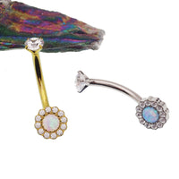 Clear CZ and Azure Blue Opal 10mm titanium belly ring with 14g gauge, body jewelry featuring a shiny, decorative design.